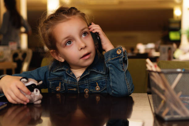 istock Girl is talking on the phone 1171624740