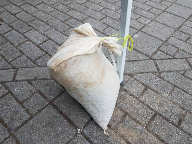 istock white sandbag on metal pole and grey bricks 1171625866