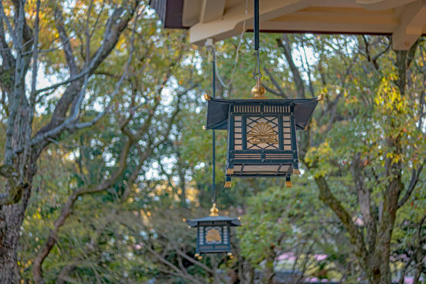 Kobe, Hyogo, Japan - April 4 2019 : Hanging lantern of the Minatogawa jinja shrine. The enshrined kami is the spirit of Masashige Kusunoki, a military commander. It is one of the Fifteen Shrines of the Kenmu Restoration.
