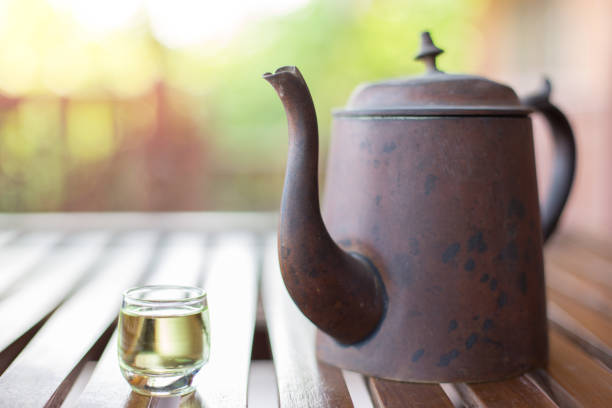 istock Antique Asian style tea set on a wooden table on blurred background with sunlight 1171626859