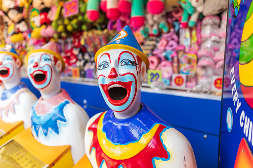Laughing Clowns In Sideshow Alley at Local Fair In Regional Australia