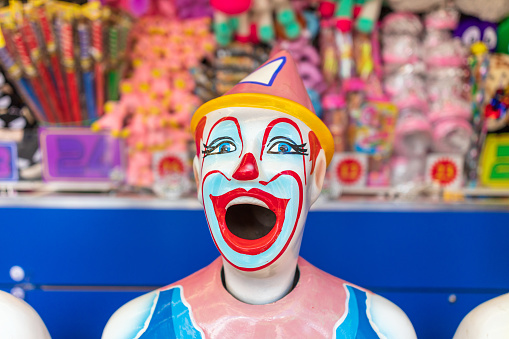 Mr Clown. Funny shocked face comedian Clown man in colorful costume wearing wig shout out loud wow with megaphone mouth announcement. Happy expression amazed bozo in various pose on isolated.