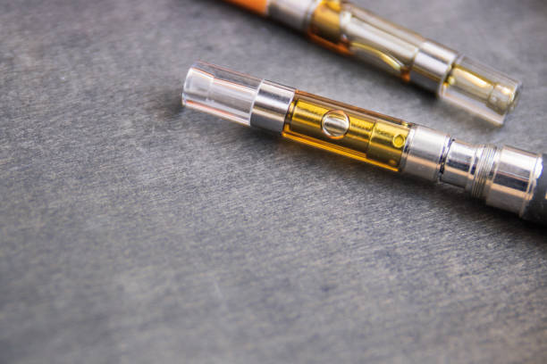 istock THC:CBD Extract Oil In Vape Pen Up Close 1171628814