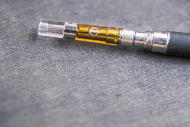 istock THC:CBD Extract Oil In Vape Pen Up Close 1171628816