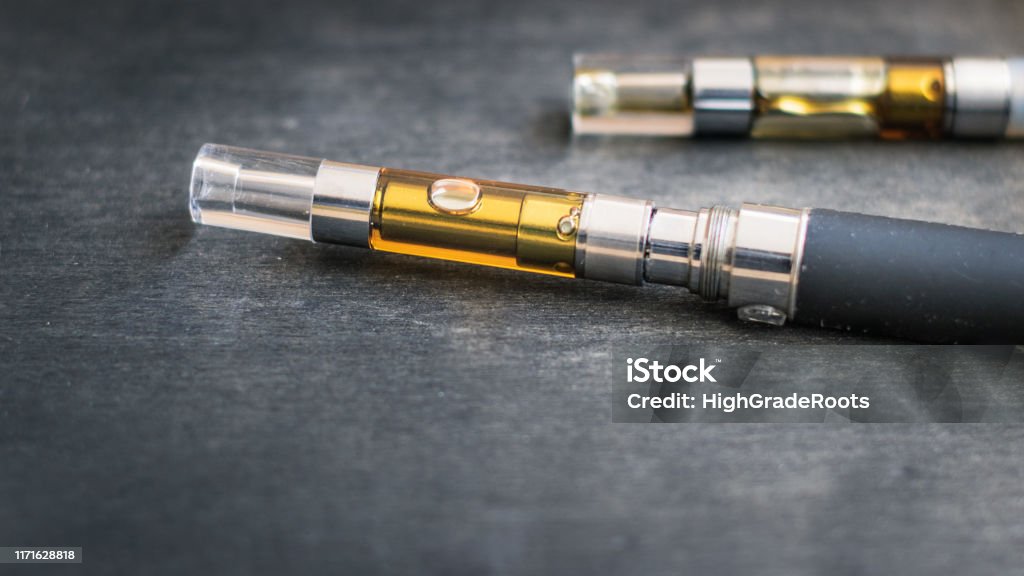 THC:CBD Concentrate Oil Filled Vape Pens Cannabis oil vape pen cartridges. Alternative method of smoking the THC extracted from marijuana plants. Electronic Cigarette Stock Photo
