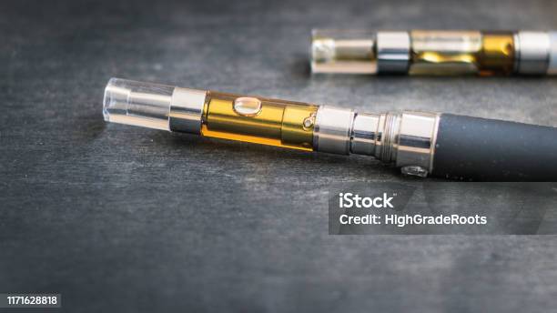Thccbd Concentrate Oil Filled Vape Pens Stock Photo - Download Image Now - Electronic Cigarette, Cannabis Plant, Cannabis - Narcotic