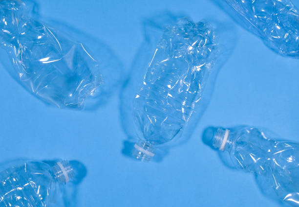 istock Plastic bottles isolated on blue background. Recycle waste management concept. Plastic Pet Bottles. 1171632489