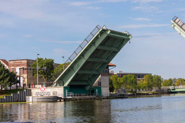 istock Manitowoc,WI,USA August 31, 2019 :  lifting drawbridge over Manitowoc river 1171639323