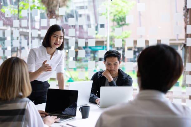 istock Diverse startup young business people group working together on laptop at modern office. 1171640571