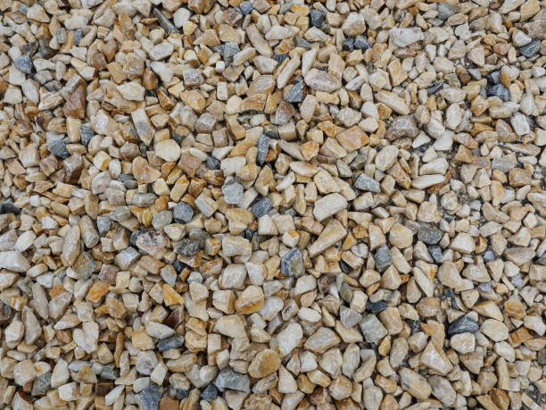 istock Beige and yellow gravel background 1171640579