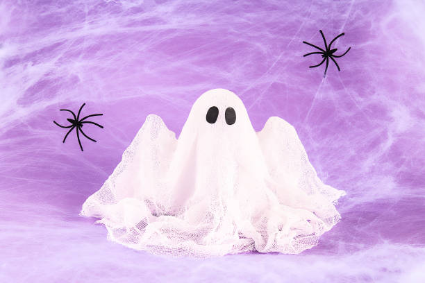 istock Halloween holiday concept. White spider web with two black spider web purple background. Diy ghost 1171640748