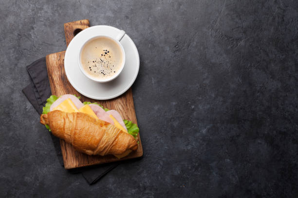 istock Coffee and croissant sandwich 1171641443