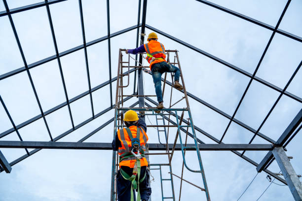 istock Roofer worker in protective uniform wear and gloves 1171642468
