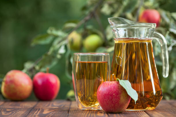 istock apple juice in glass and jug 1171642492