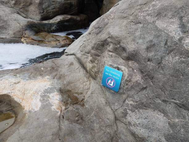 istock blue no climbing on the rocks sign 1171643268