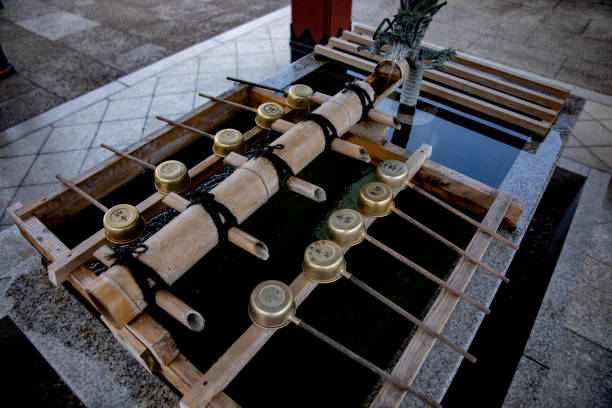 Purification trough at Japanese traditional temple. Ota district Tokyo Japan - 08.26.2019 : It s a purification trough called Chozuya at the traditional shrine. camera : Canon EOS 5D mark4