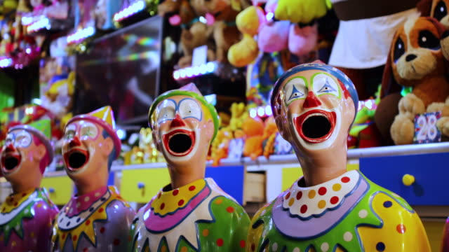 Laughing Clowns In Sideshow Alley at Local Fair