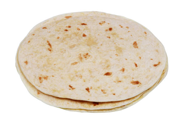istock Round soft wheat flour tortilla pancakes. Isolated 1171643604