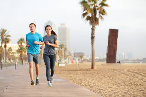 istock Running couple jogging Barcelona Beach Barceloneta 1171646253
