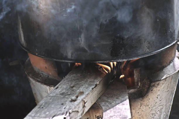 istock Boiling water to cook noodles using firewood 1171646327