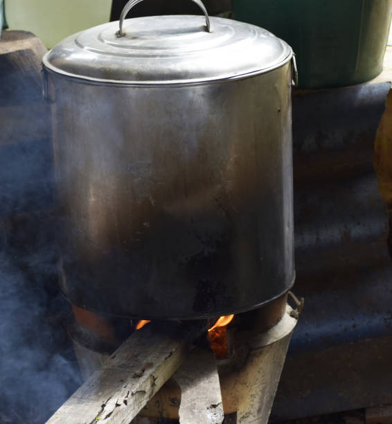istock Boiling water to cook noodles using firewood 1171646331