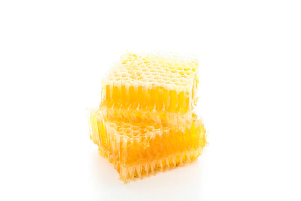 istock Pieces of honeycomb isolated on white background, close up 1171648016