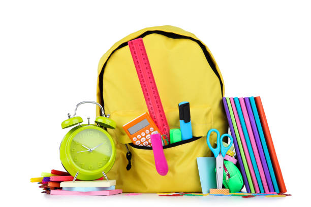 istock School supplies with yellow backpack on white background 1171650152