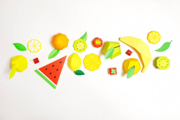 istock exotic fruit made of paper on white background. 1171652096
