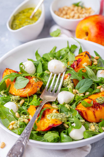 istock Salad with arugula, nectarines and pesto sauce. 1171652142