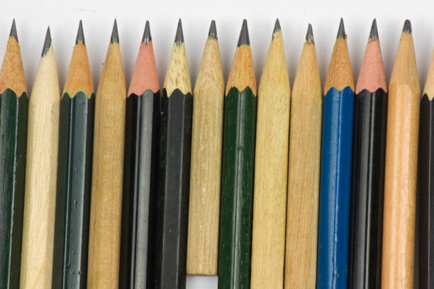 istock Pencil with sharpening on white paper background. 1171652605