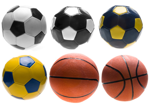 Four different types soccer ball and basketballs in two different angles.