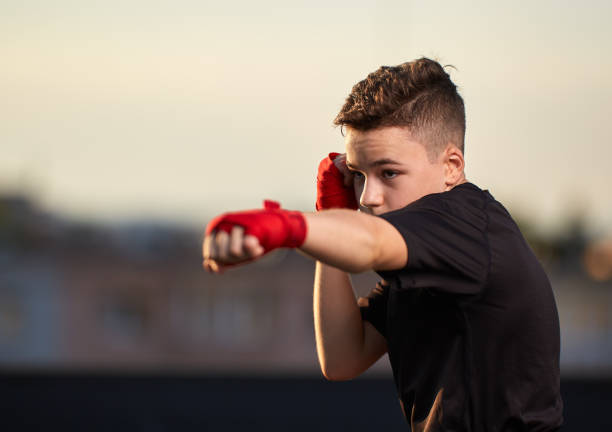 Young fighter training on the roof stock photo