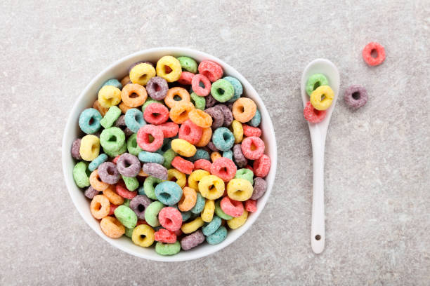 istock Colorful corn rings in bowl on gray background 1171653495