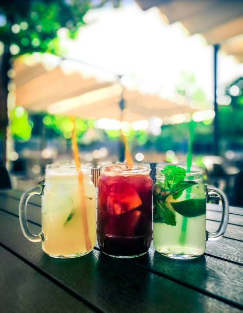 istock Glass Jars of Fresh Fruit Juice outdoors in summer 1171654801