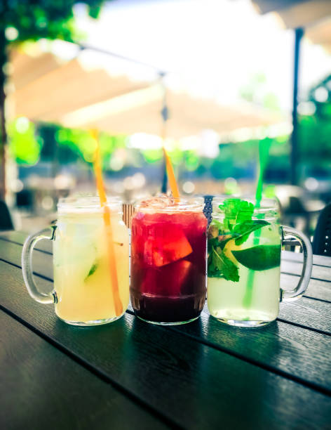 istock Glass Jars of Fresh Fruit Juice outdoors in summer 1171654805
