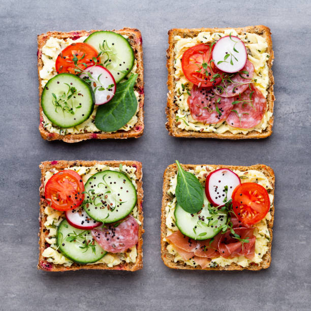 istock Sandwiches with cream cheese, vegetables and salami. 1171656065