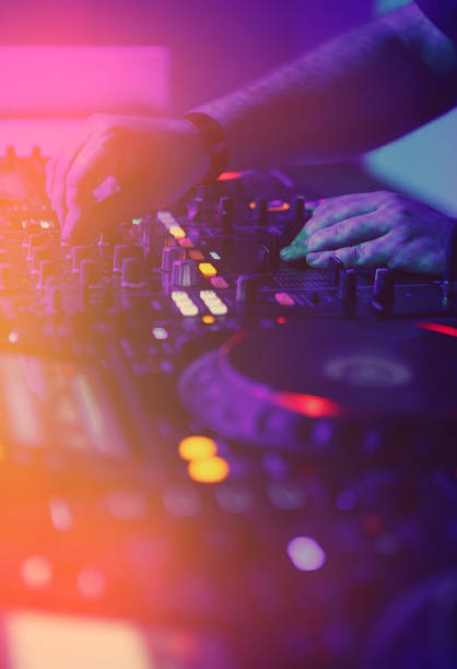 istock Professional dj audio setup on stage in night club 1171658388