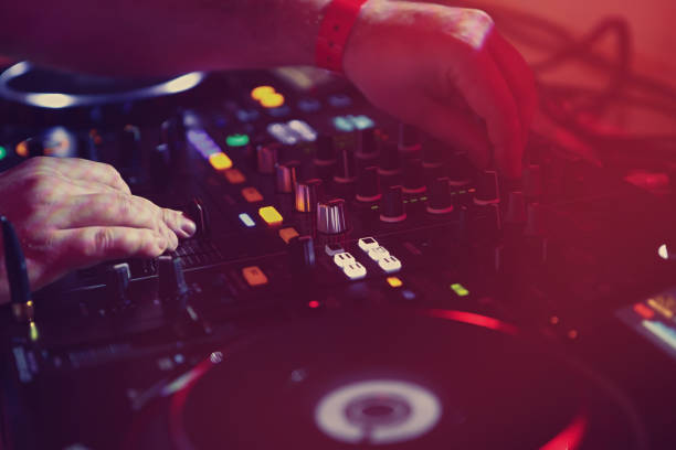 istock Professional dj audio setup on stage in night club 1171658469