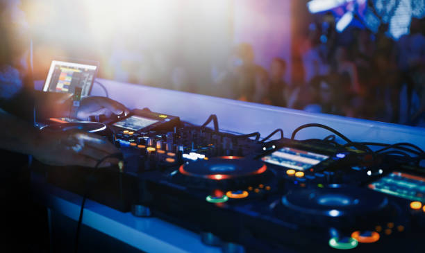 istock Professional dj audio setup on stage in night club 1171658475