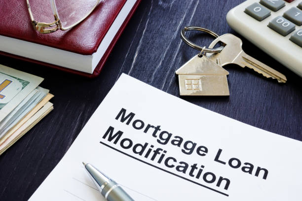 istock Mortgage Loan Modification agreement and keys from home. 1171659633