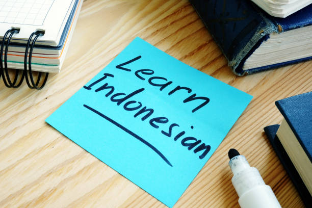 istock Piece of page with inscription Learn Indonesian language. 1171659754