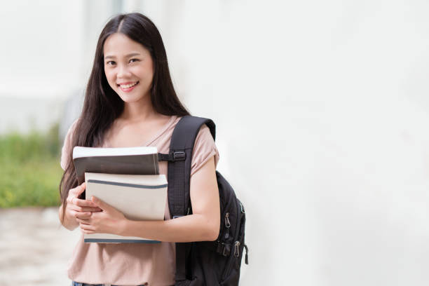 istock Concept asian students Stay at university He holds a textbook. 1171660567