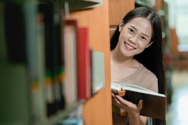 istock Asian students are reading book in the library 1171660800