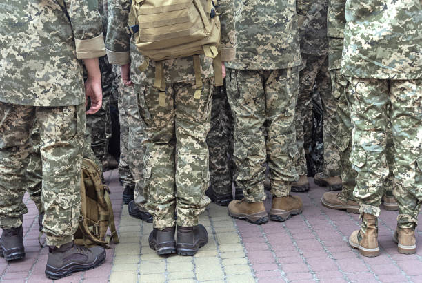 istock Soldiers in pixel camouflage uniforms 1171662594
