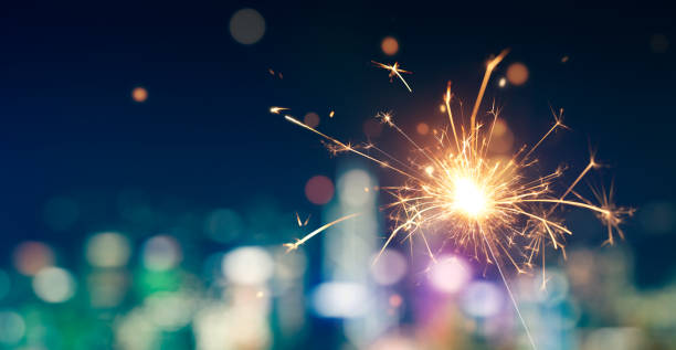 istock Sparkler with blurred city light background, Happy New Year 1171665661