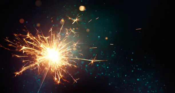Sparkler on abstract background