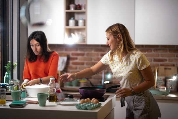 istock Two female friends making a meal 1171671822