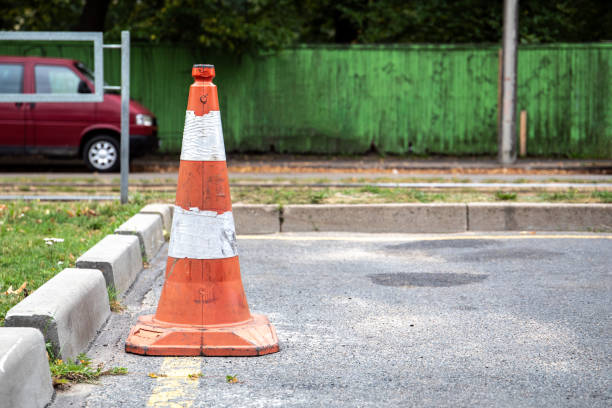 istock Plastic orange traffic cone on city street 1171672118