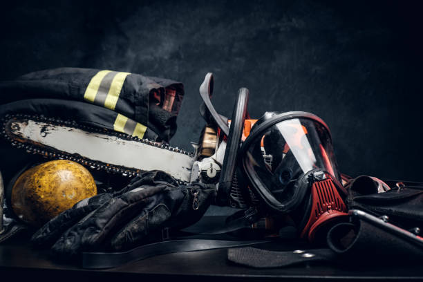 istock Safety unform on the table with respirator and chainsaw. 1171673614