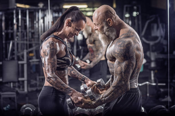 istock Tattooed Senior Couple During Gym Workout 1171673658